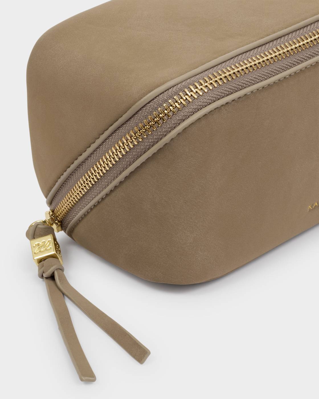 Beige pouch with gold zipper on a white background